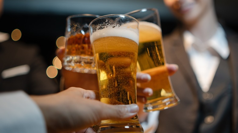 Toasting with beer and whiskey glasses