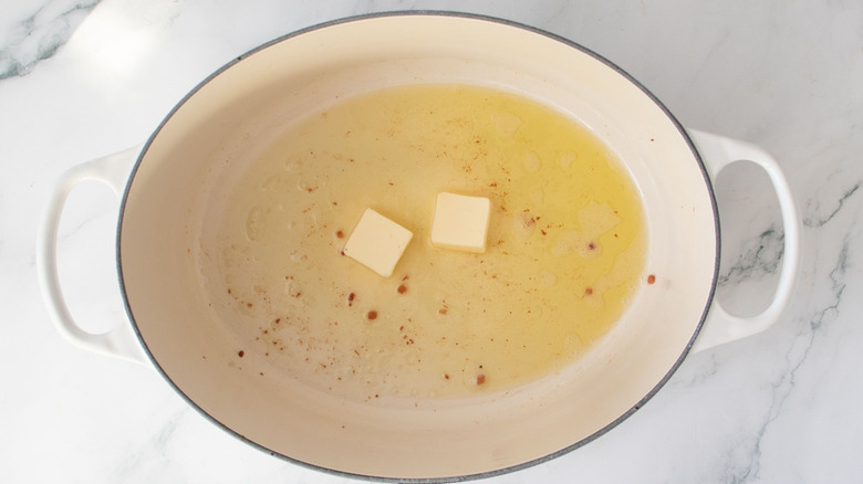 Pats of butter in Dutch oven