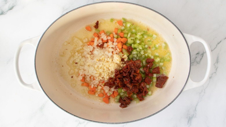 Various chopped vegetables in Dutch oven