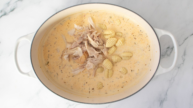 Chicken and gnocchi soup in large pot