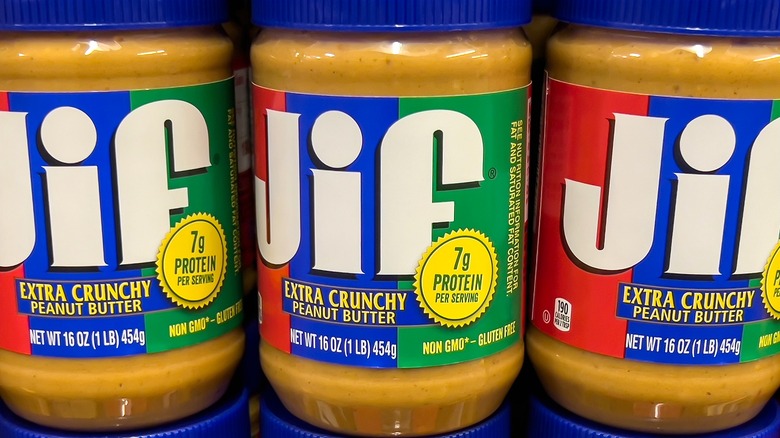 Closeup of three 16-ounce jars of Jif Extra Crunchy Peanut Butter