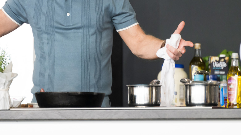Bobby Flay in front of a refrigerator at a cooking demo