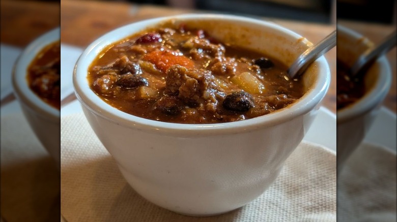 Cup of chili with spoon
