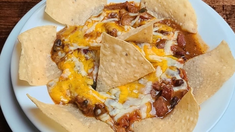 Bowl of chili with cheese and tortilla chips