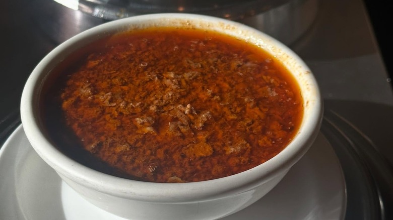 Bowl of greasy, meaty chili