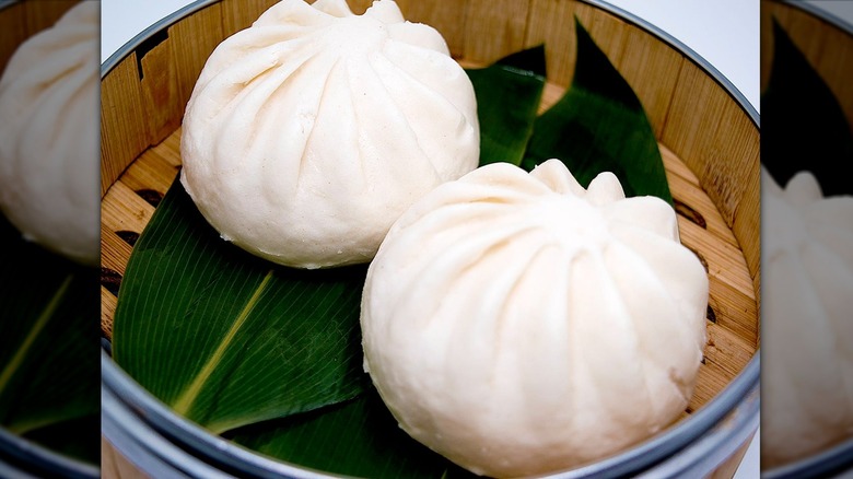 Two steamed buns in a bowl