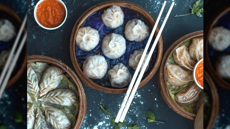 Dim sum dishes on a blue background