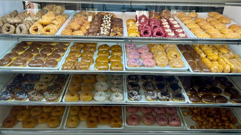 Display case full of donuts inside Doba Cafe