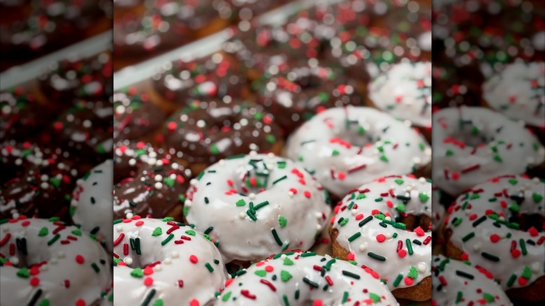 Chocolate and vanilla frosted donuts with sprinkles on a tray