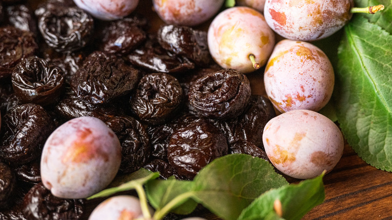 Prunes are photographed in close up.