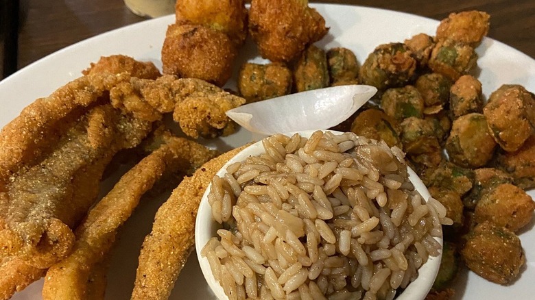 Catfish filets with rice and fried okra on plate