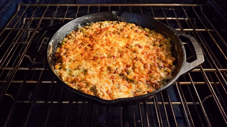 Best game day cheesy crab dip in cast iron skillet under broiler in oven