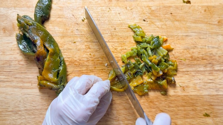 Chopping peeled poblano peppers