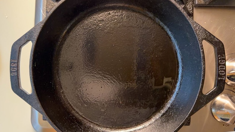 Oiled cast iron skillet on stovetop