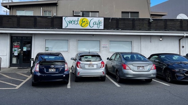 The exterior of Sweet E's Cafe with cars parked outside