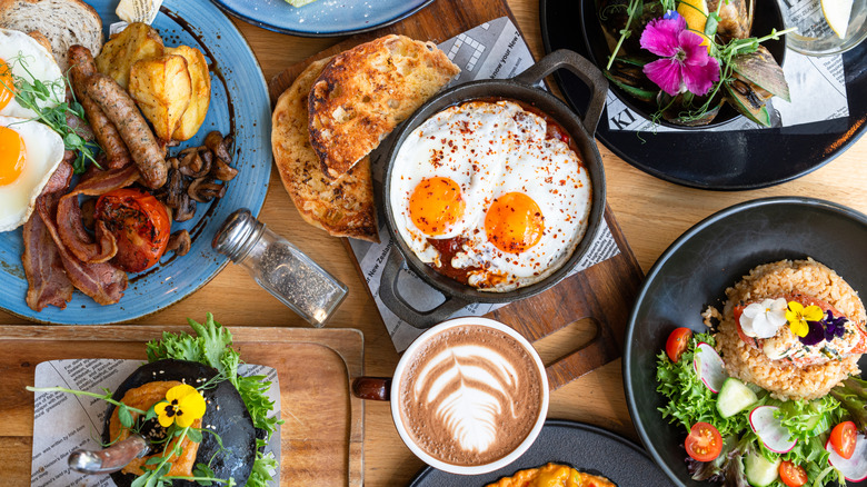 A display of various breakfast and brunch food spread across a table