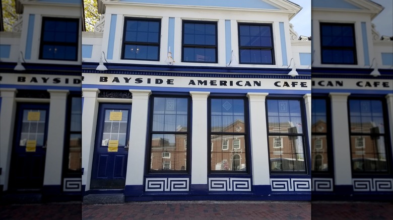 The blue and white exterior of American Bayside Cafe