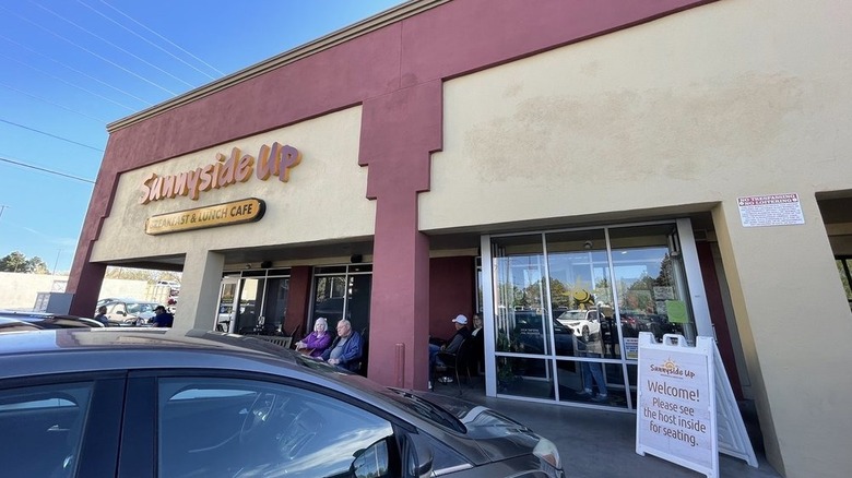 The exterior of Sunnyside Up with people sitting outside