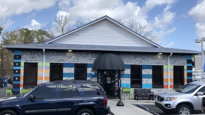 Exterior of the Early Bird Diner with cars parked outside