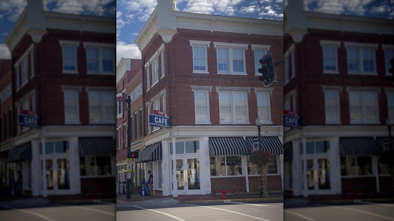 Exterior of Frost Cafe in a red brick building on a street corner