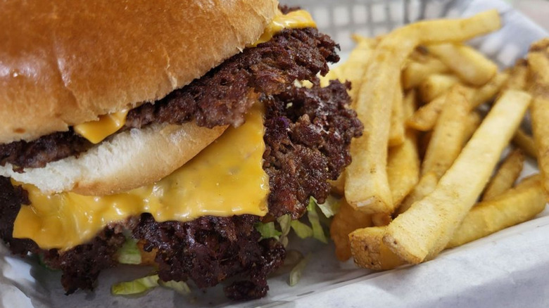 A burger and onion rings from Workingman's Friend