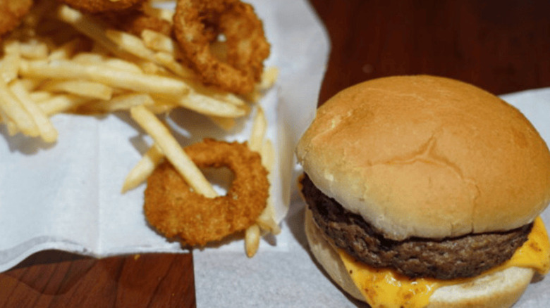 A burger, fries, and onion rings from Miller's Bar