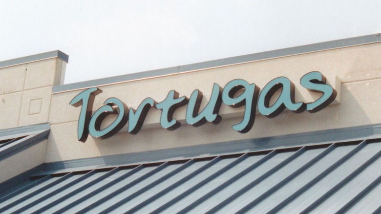The exterior sign at Tortuga's Pizza in Hoover