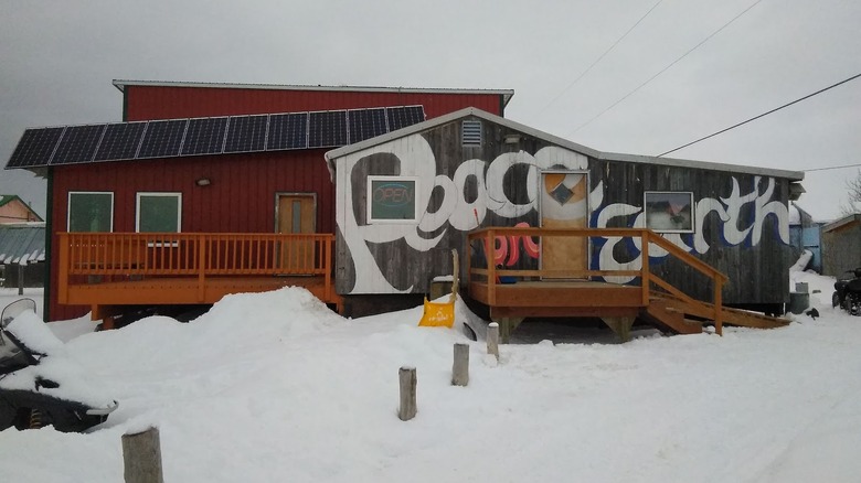 Exterior of Peace on Earth restaurant in heavy snow