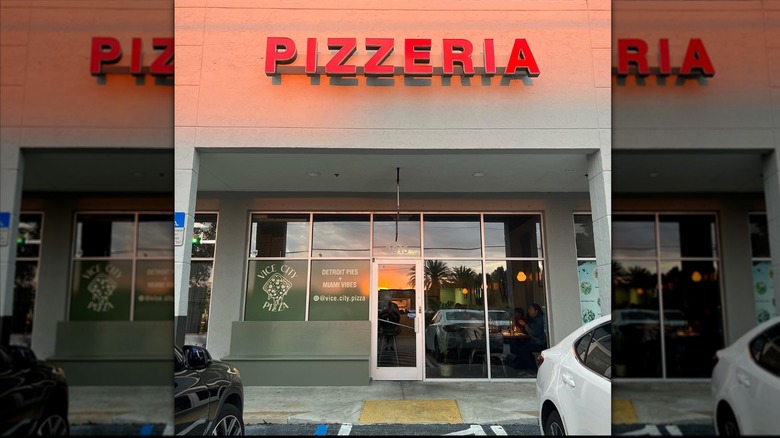 The exterior of Vice City Pizza at sunset