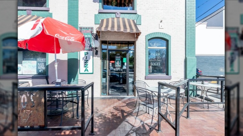 The exterior and patio of Guido's Original New York Style Pizza