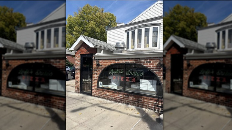 The red brick exterior of Louie & Ernie's Pizza