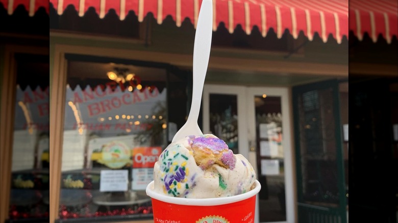 Cup of ice cream with sprinkles in front of the Angelo Brocato storefront