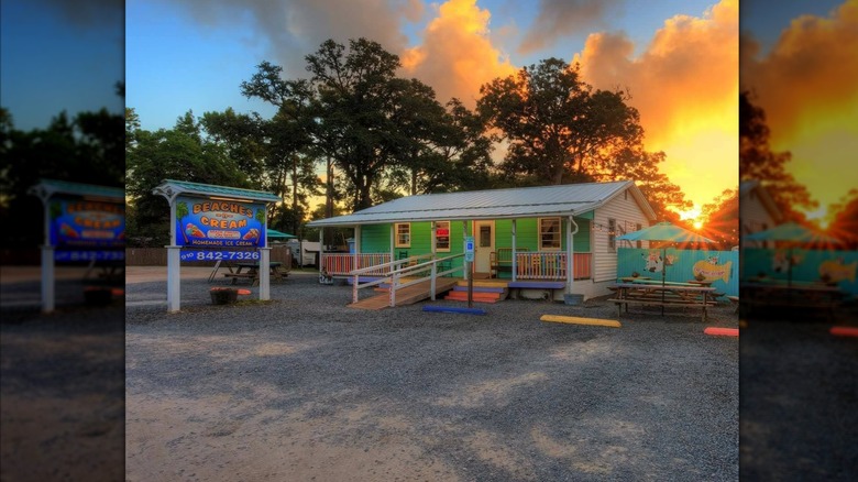 Exterior of Beaches-N-Cream as the sun sets in the background
