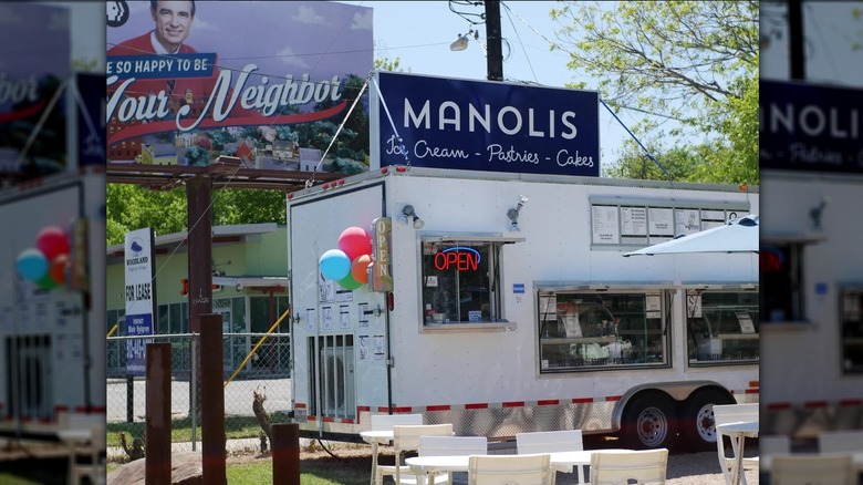 Exterior of Manolis with chairs and tables