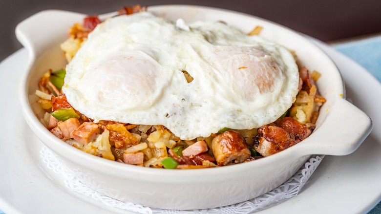 Dish with hash and two eggs on top