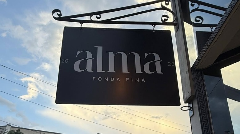 An exterior shot of Alma Fonda Fina, highlighting the restaurant's signage