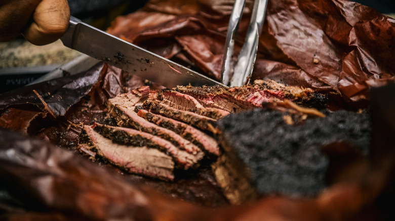 Slicing into brisket close-up