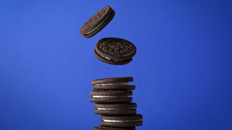 Stack of Oreos in front of a blue background