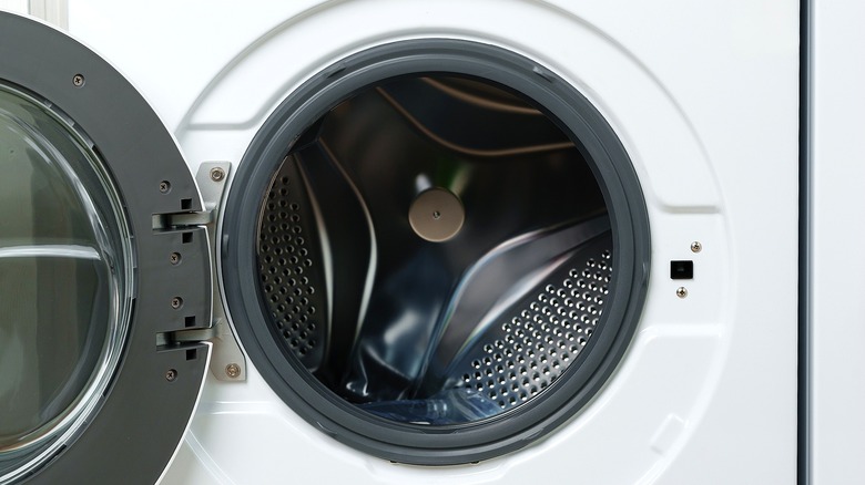 A white clothes dryer sits open