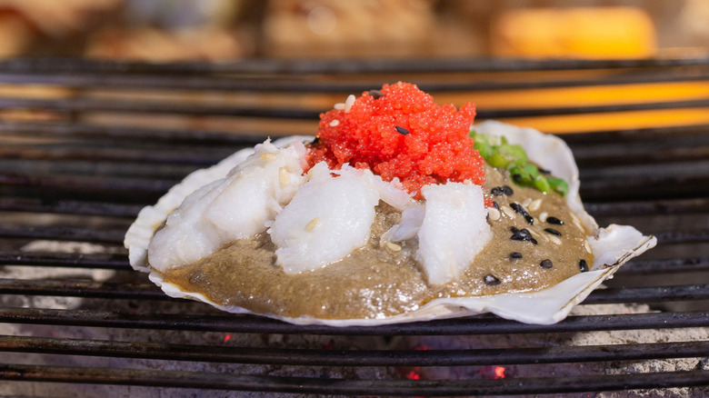 Tobiko style scallops on the grill.