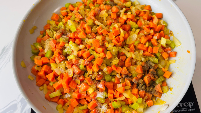 Diced carrot, celery, and onion in pan