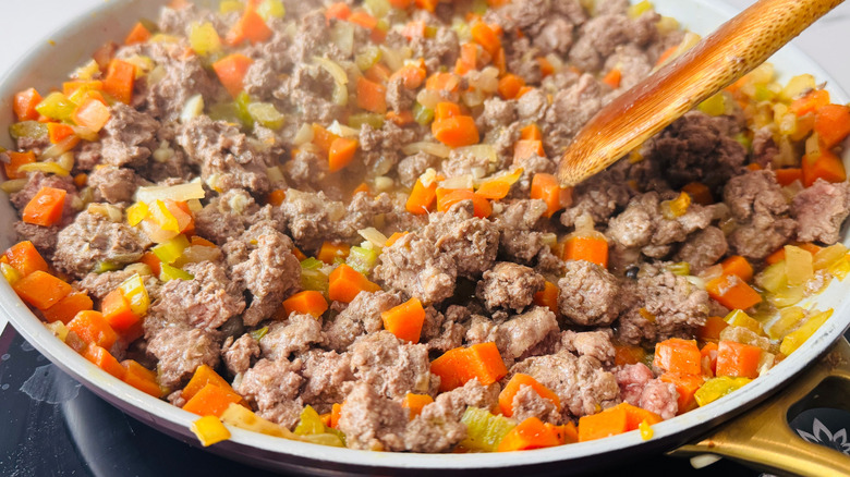 Ground lamb and mixed veggies in pan