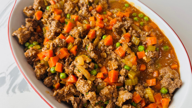 Shepherd's pie filling in large oval baking dish