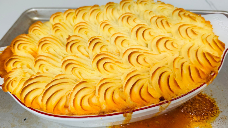 Baked shepherd's pie on top of baking sheet