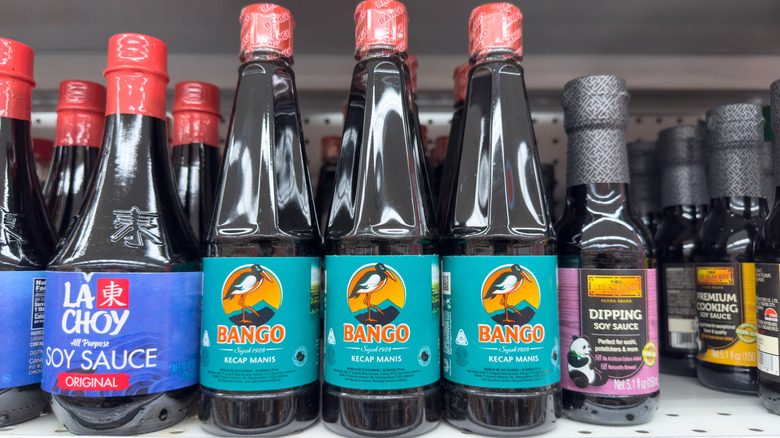 Bottles of kecap manis on a supermarket shelf