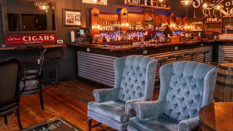 Chairs with bar in the background inside The Vault