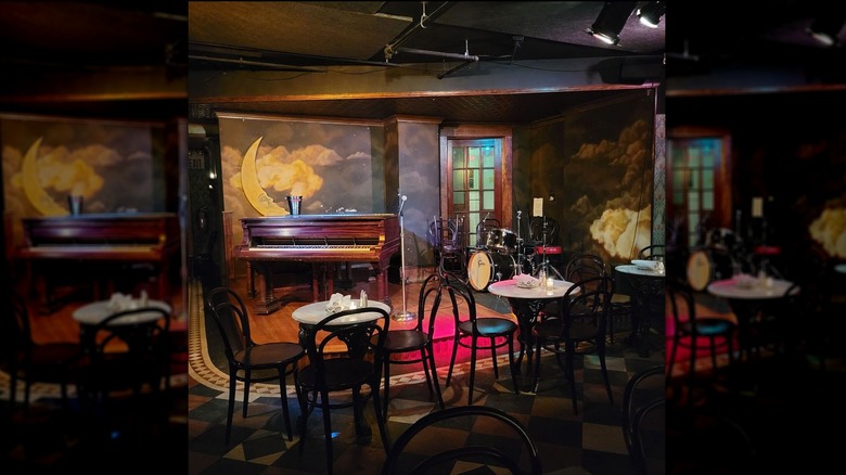 Interior of Volstead's Emporium, including tables and stage area