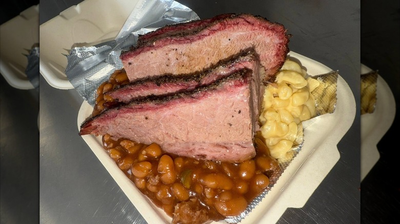Sliced brisket and sides from Bless Your Heart BBQ