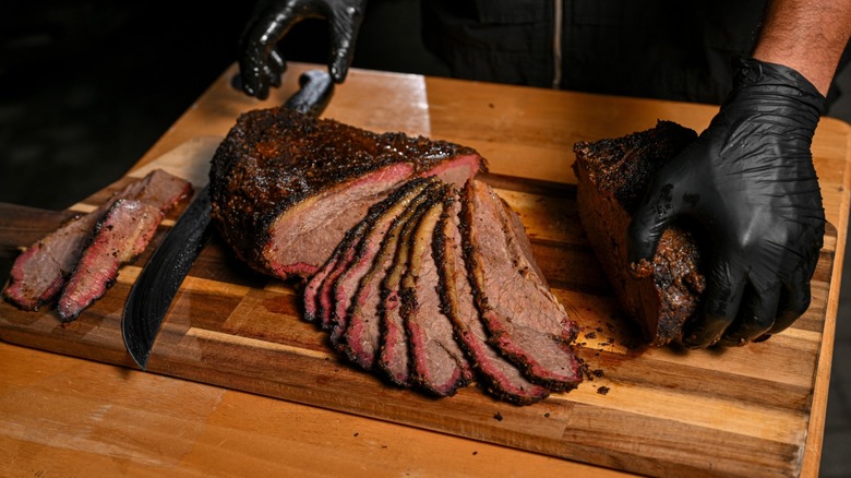 Sliced barbecue brisket on a cutting board