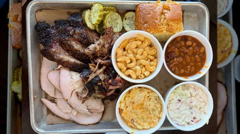 A tray of meats and sides from Whatcha Smokin? BBQ + Brew